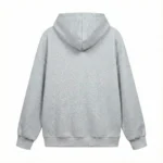 Back view of plain light grey hoodie showcasing clean minimalist design, ribbed hem, and hood construction.