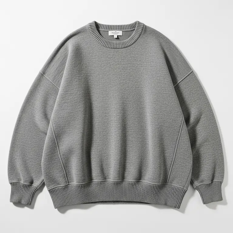 Man wearing a premium heavyweight grey hoodie with a boxy oversized fit and standing hood structure.